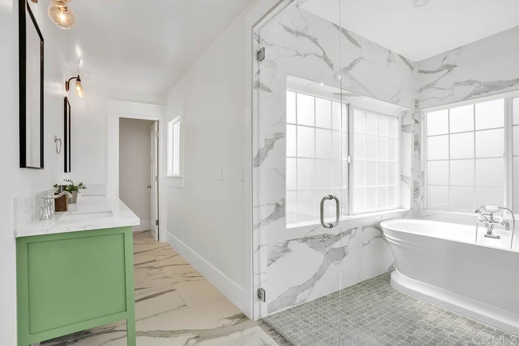 1864 Sunset Boulevard San Diego, CA 92103 - Photo 32 of 57 a bathroom with a double vanity sink mirror and bathtub