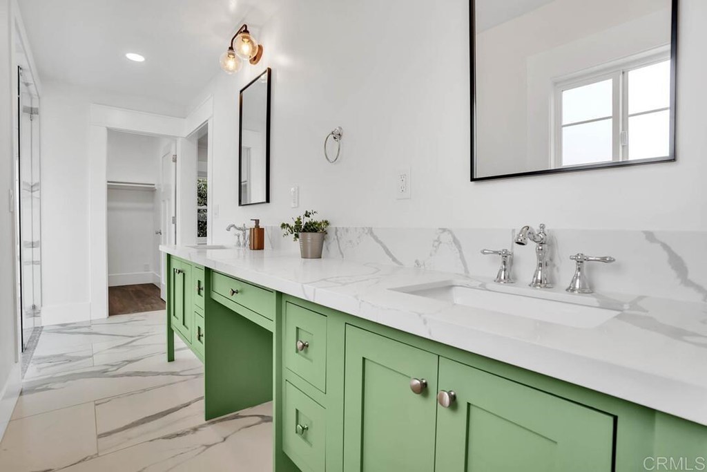 1864 Sunset Boulevard San Diego, CA 92103 - Photo 33 of 57 a bathroom with a sink and a mirror