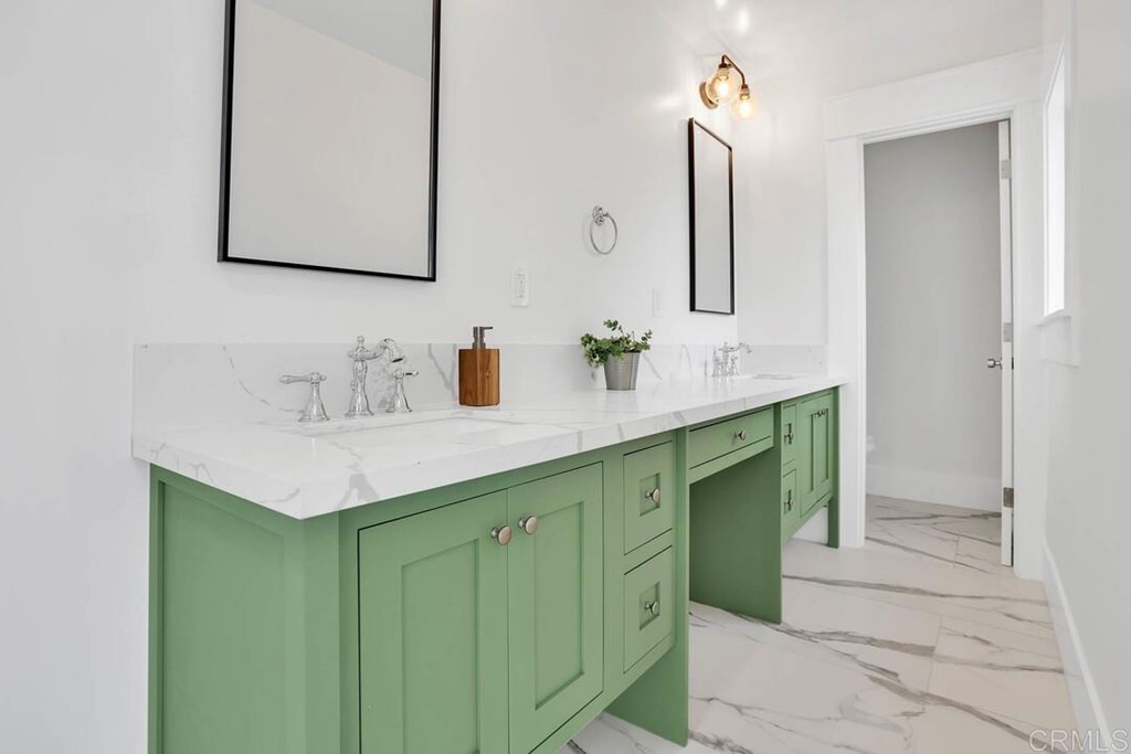 1864 Sunset Boulevard San Diego, CA 92103 - Photo 34 of 57 a bathroom with a sink and a mirror