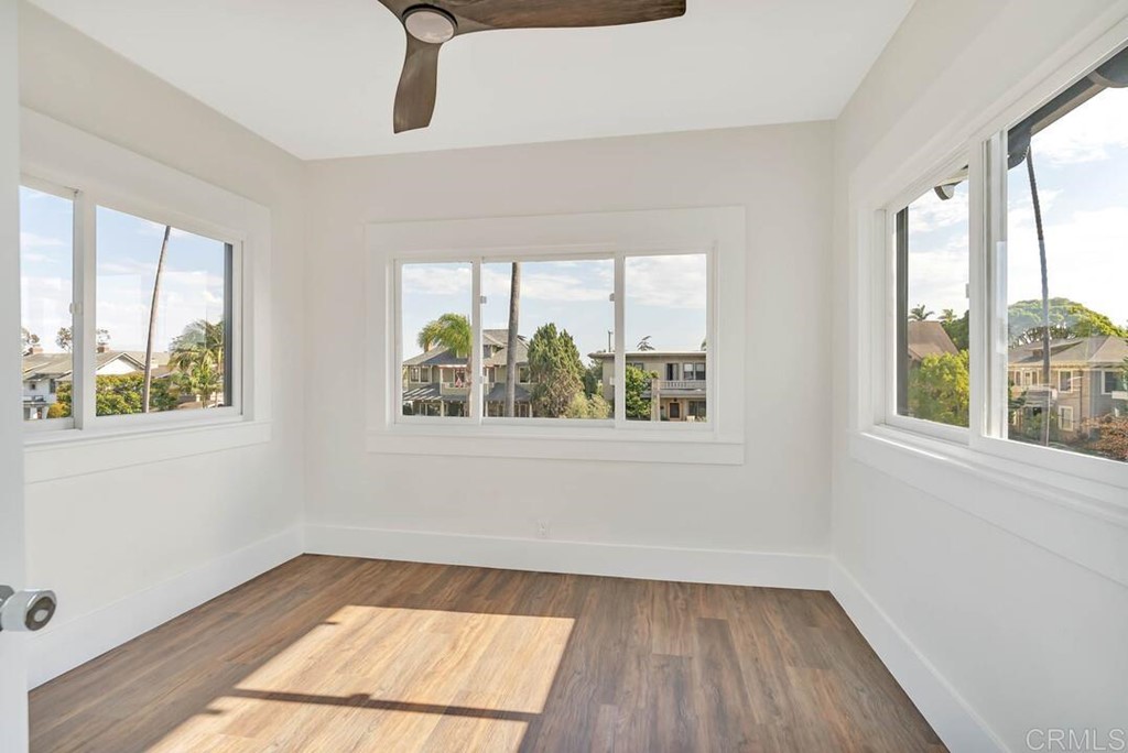 1864 Sunset Boulevard San Diego, CA 92103 - Photo 35 of 57 a view of an empty room with wooden floor and a window