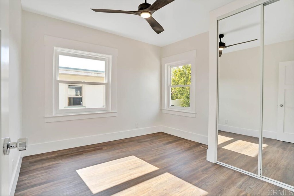 1864 Sunset Boulevard San Diego, CA 92103 - Photo 36 of 57 a view of an empty room with wooden floor and a window