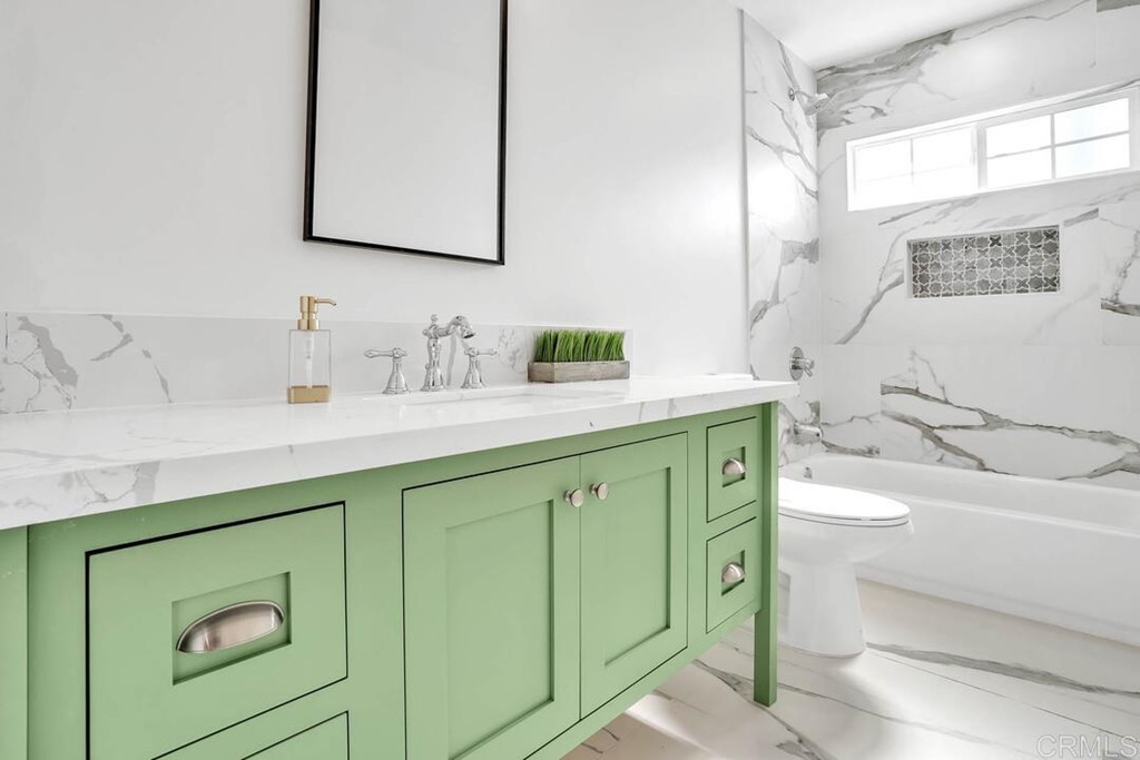 1864 Sunset Boulevard San Diego, CA 92103 - Photo 38 of 57 a bathroom with a sink and a mirror