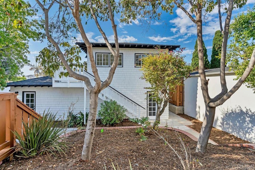 1864 Sunset Boulevard San Diego, CA 92103 - Photo 42 of 57 a view of a house with large tree and wooden fence