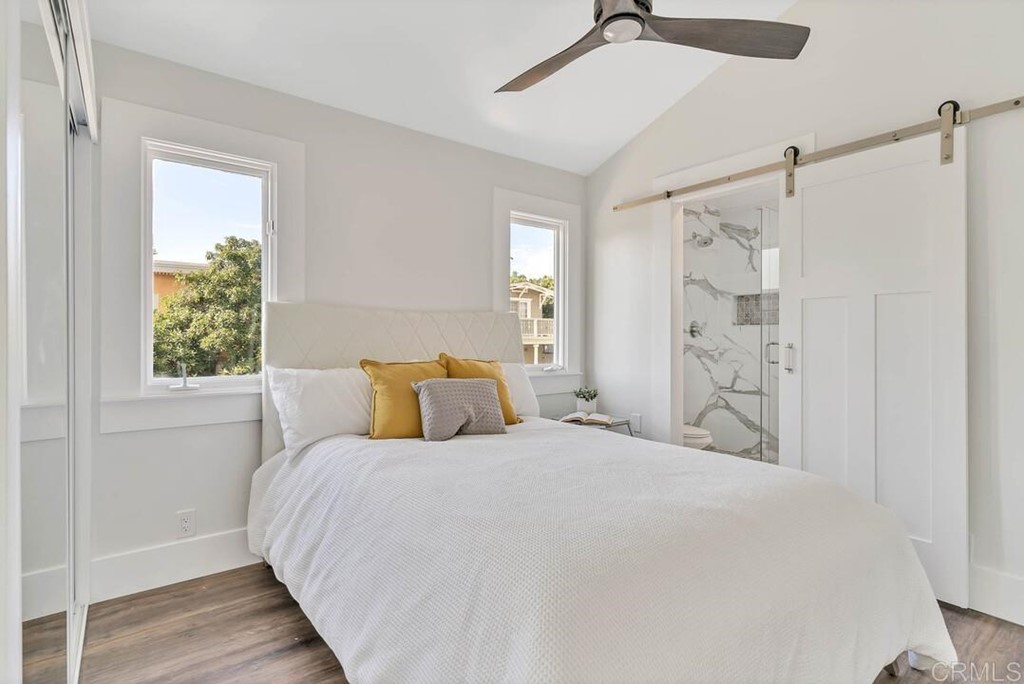 1864 Sunset Boulevard San Diego, CA 92103 - Photo 48 of 57 a bedroom with a bed and a window