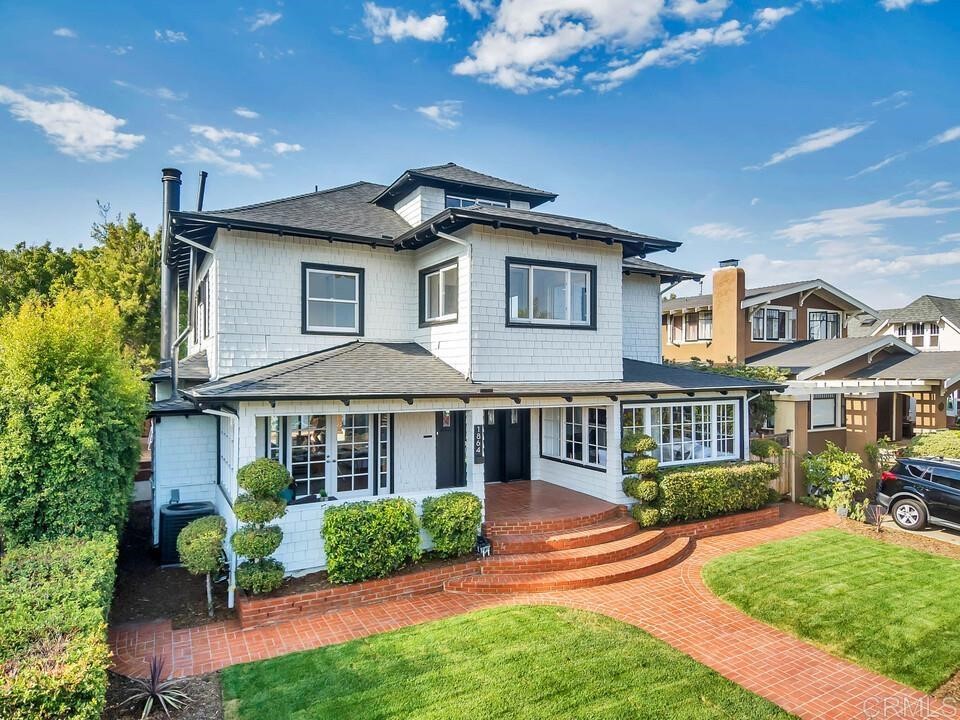 1864 Sunset Boulevard San Diego, CA 92103 - Photo 57 of 57 a front view of a house with a yard table and chairs