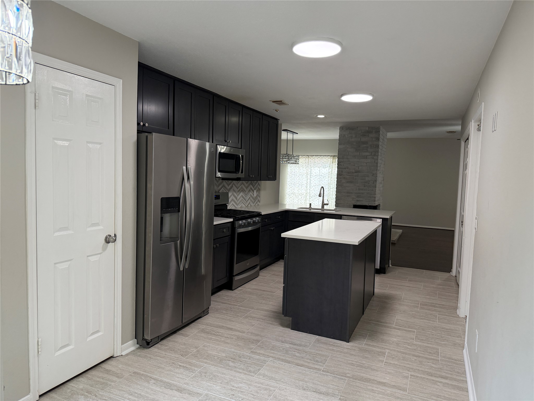 75 East Village Knoll Circle Spring, TX 77381 - Photo 14 of 33 a kitchen with a refrigerator and a sink