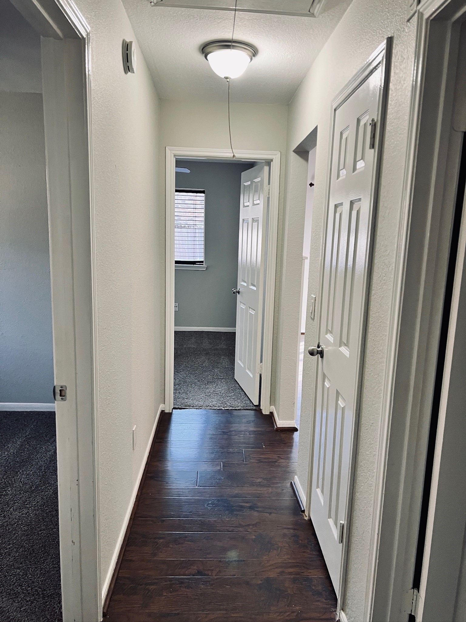75 East Village Knoll Circle Spring, TX 77381 - Photo 16 of 33 a view of a hallway with wooden floor and staircase