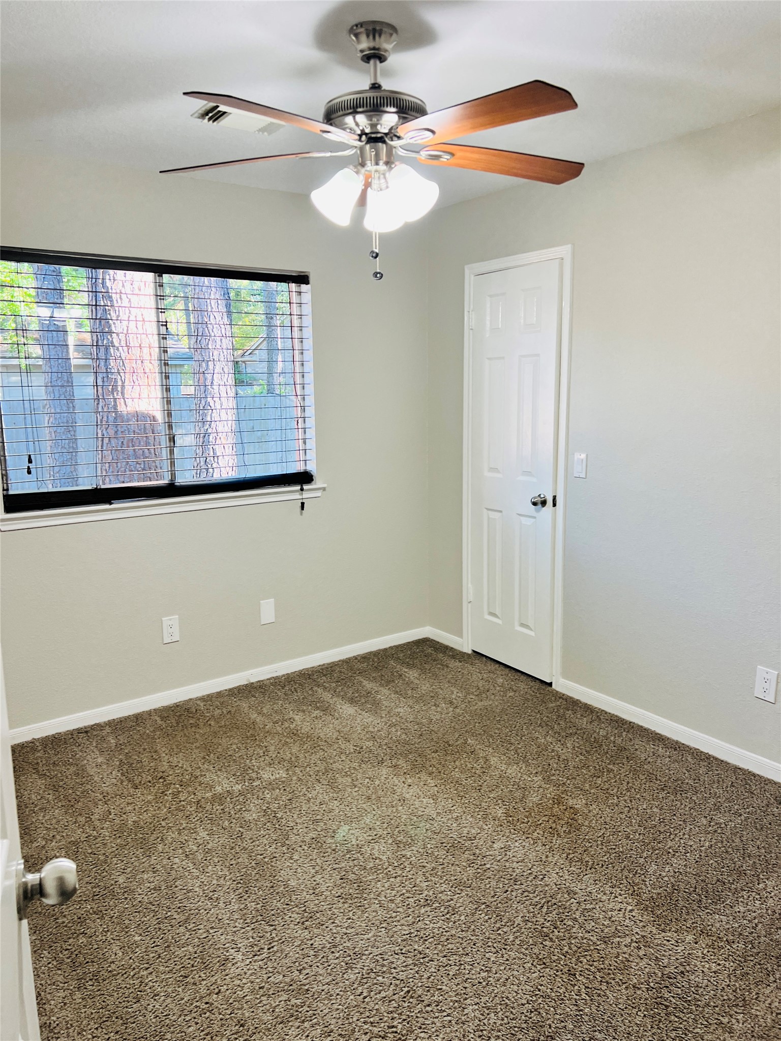 75 East Village Knoll Circle Spring, TX 77381 - Photo 18 of 33 an empty room with windows and fan