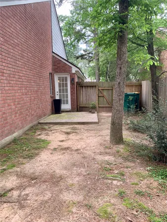 a front view of a house with a garden and yard