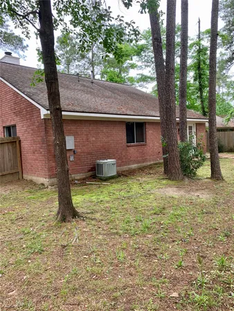 a backyard of a house with barbeque oven
