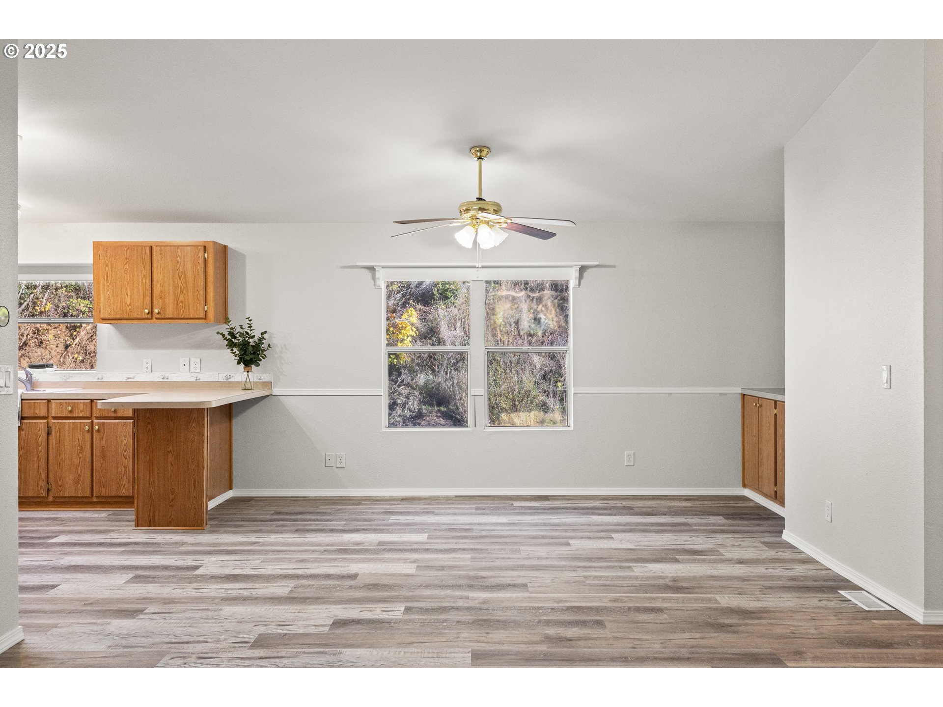 20191 Highway 42 Myrtle Point, OR 97458 - Photo 11 of 41 a view of an empty room with wooden floor and a window
