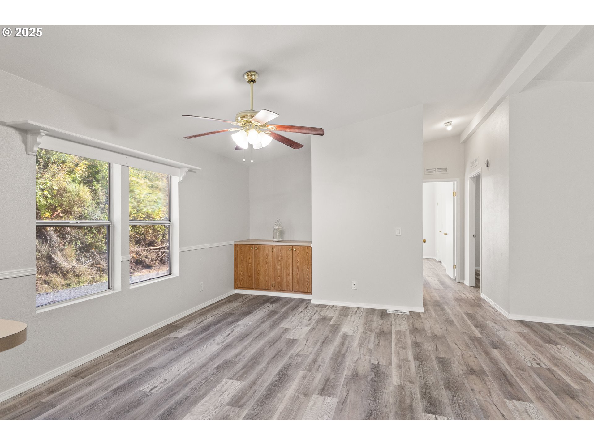 20191 Highway 42 Myrtle Point, OR 97458 - Photo 12 of 41 a view of an empty room with wooden floor and a window