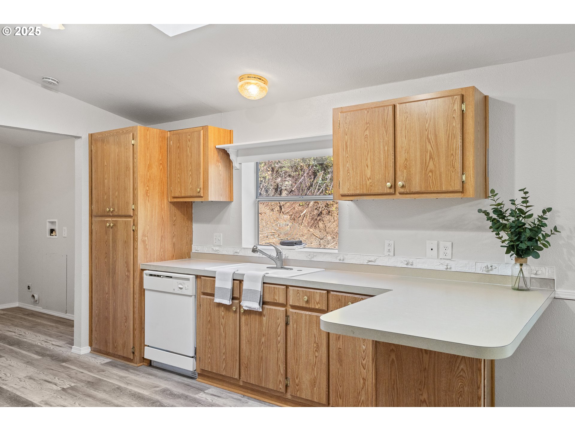 20191 Highway 42 Myrtle Point, OR 97458 - Photo 14 of 41 a kitchen with a sink a refrigerator and a stove