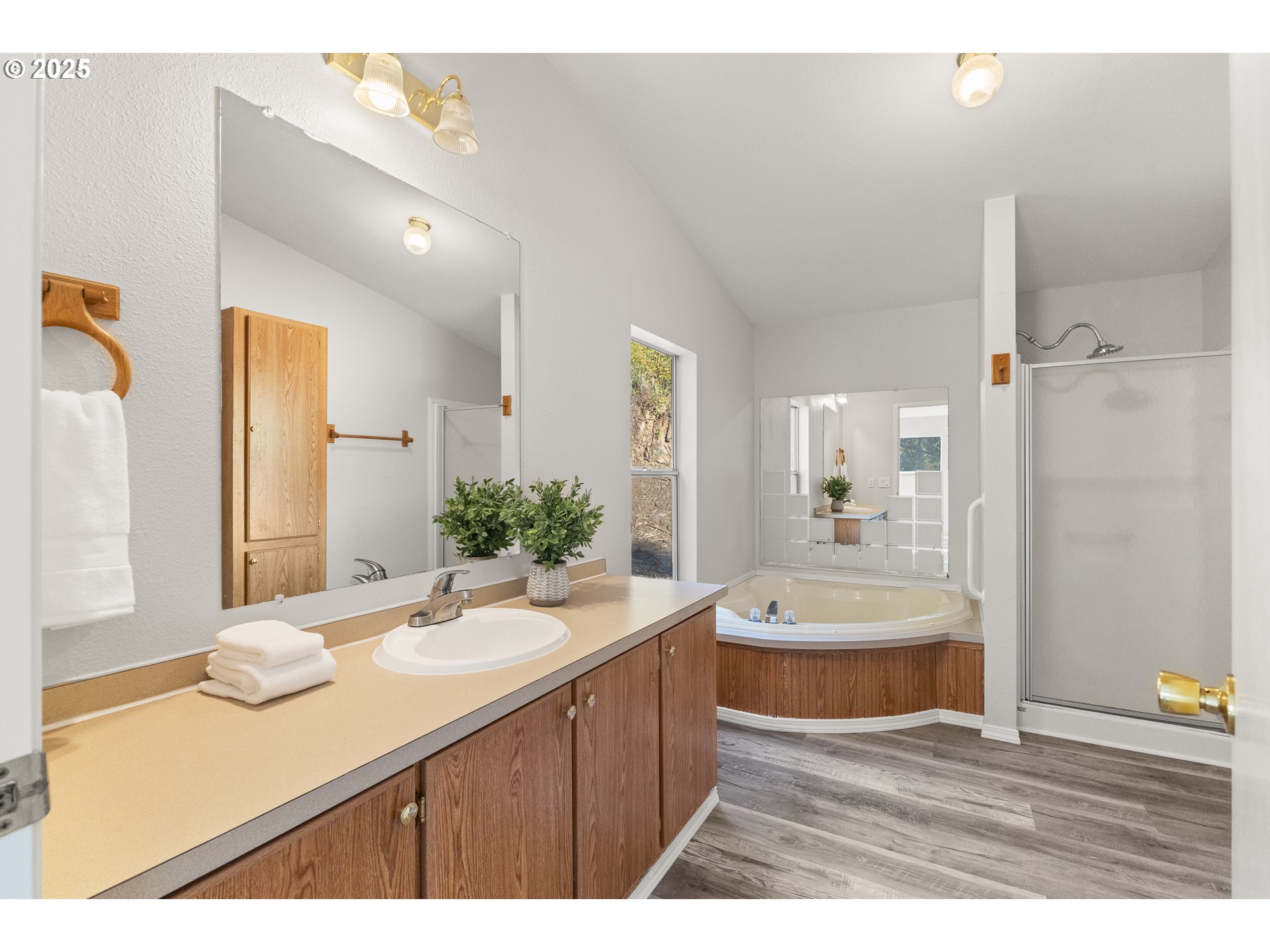 20191 Highway 42 Myrtle Point, OR 97458 - Photo 21 of 41 a bathroom with a sink double vanity granite tub shower and a mirror