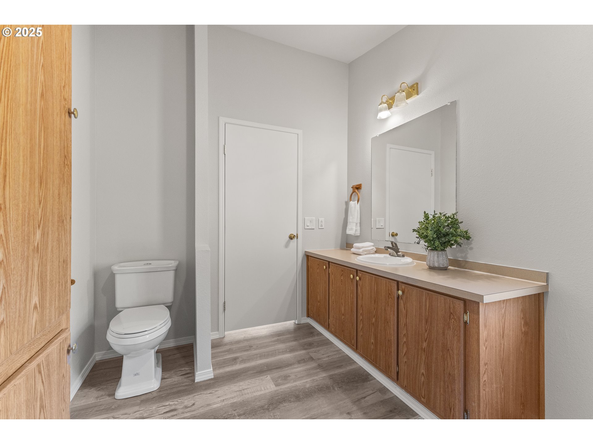 20191 Highway 42 Myrtle Point, OR 97458 - Photo 22 of 41 a bathroom with a granite countertop sink a toilet and a mirror