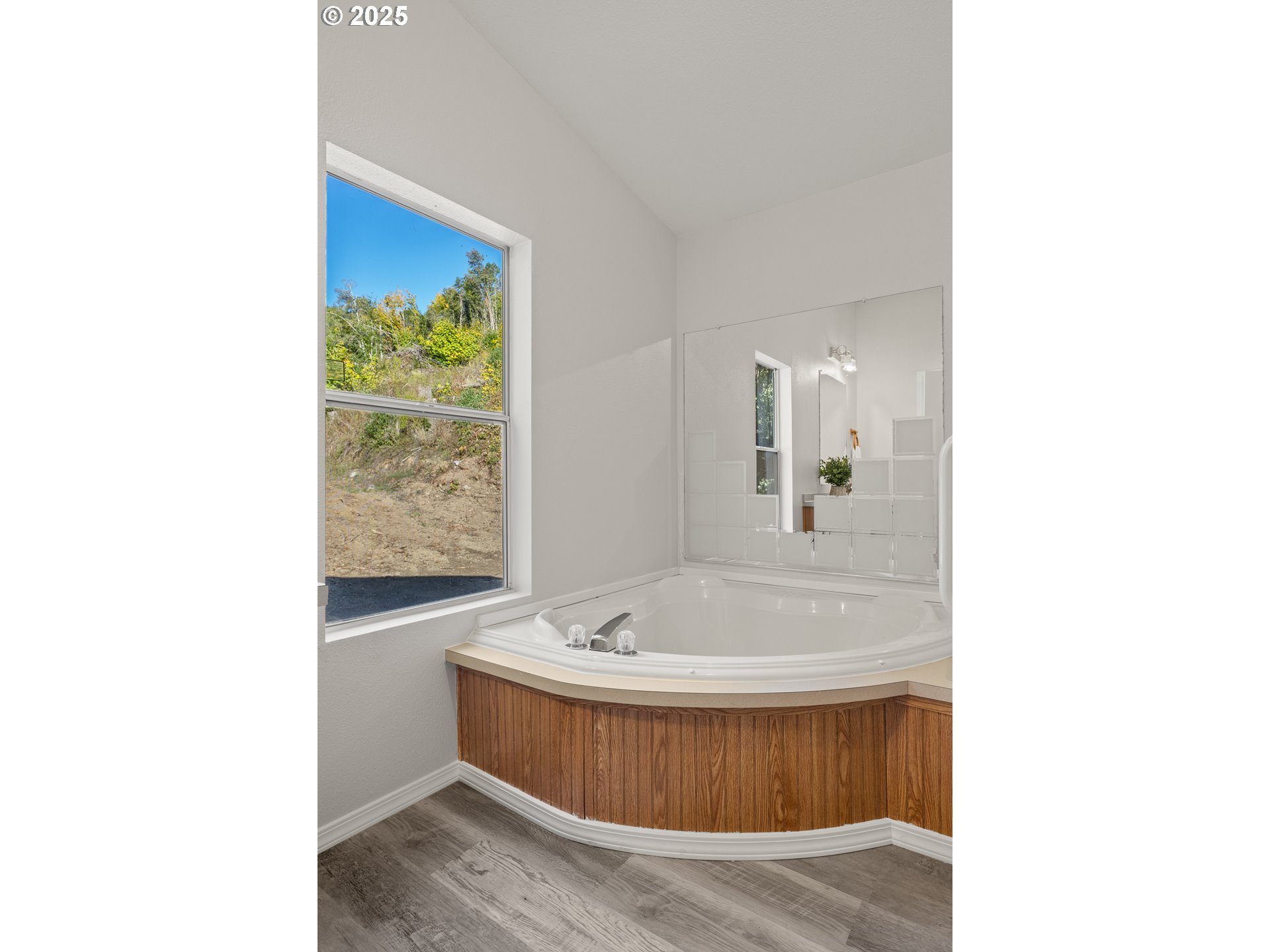 20191 Highway 42 Myrtle Point, OR 97458 - Photo 23 of 41 a bathroom with a tub sink and mirror