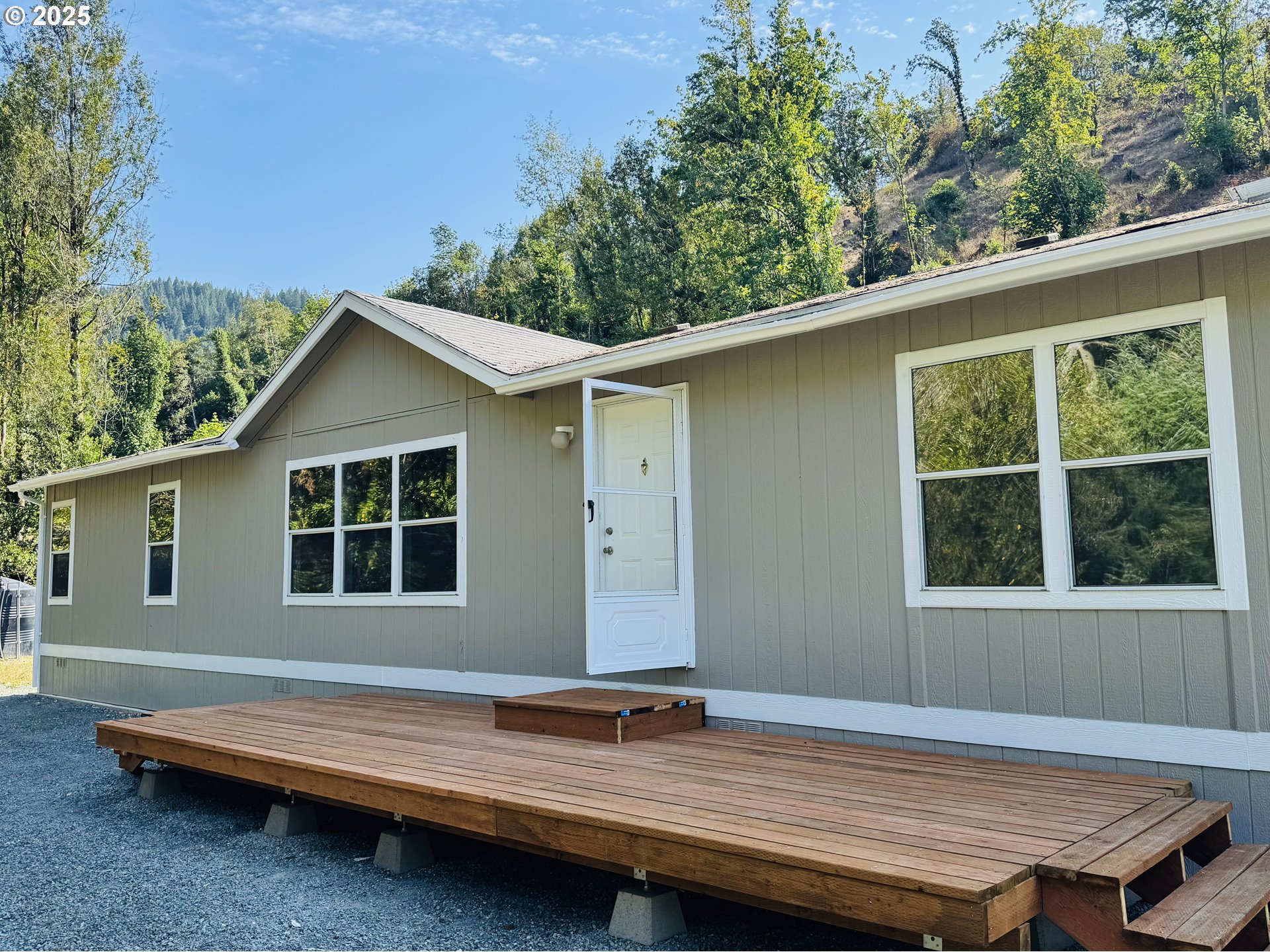 20191 Highway 42 Myrtle Point, OR 97458 - Photo 5 of 41 a wooden bench sitting in front of a house