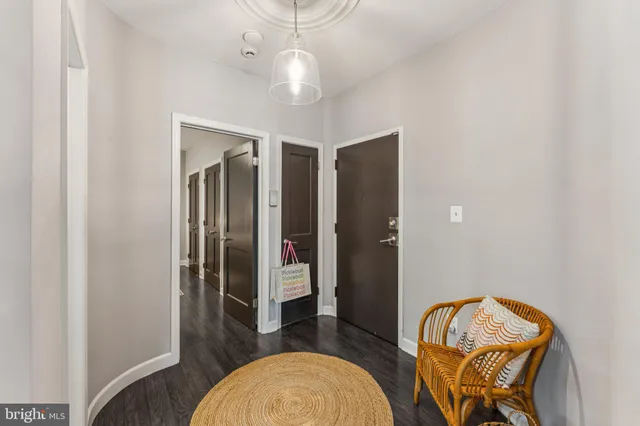 a view of a livingroom with furniture and wooden floor