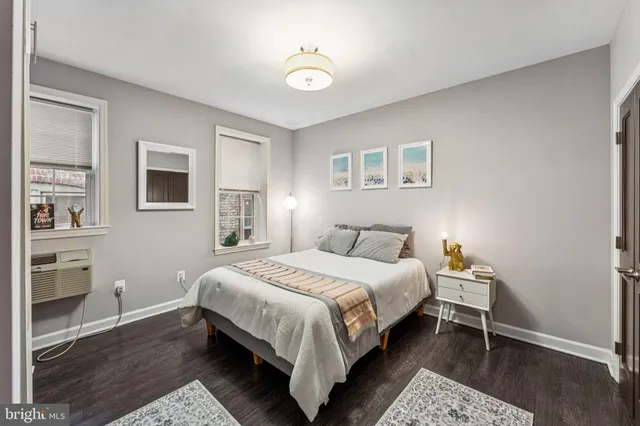 a bedroom with a bed and a desk