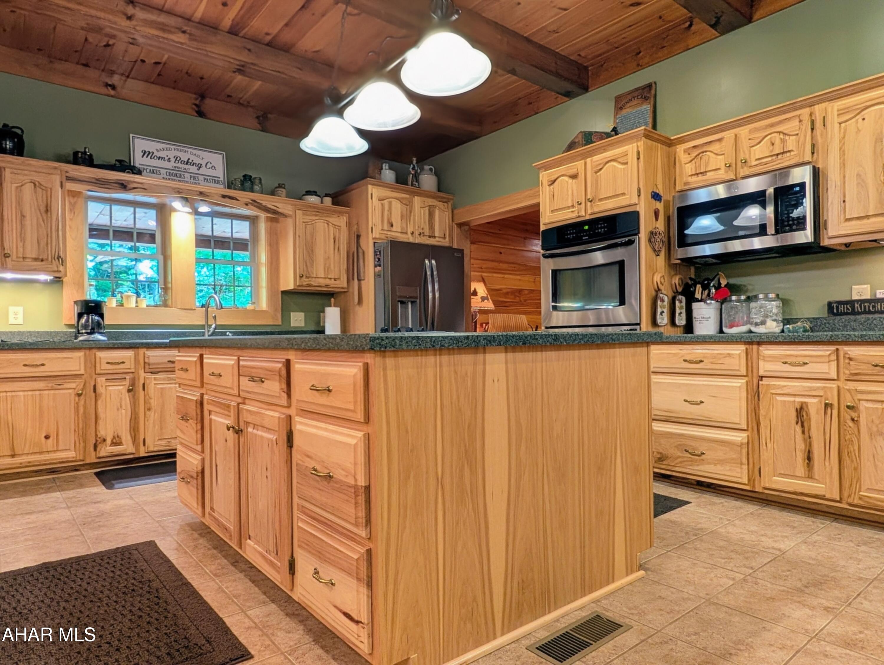 213 Sherman Valley Road Hopewell, PA 16650 - Photo 13 of 104 a kitchen with stainless steel appliances granite countertop a stove and a sink