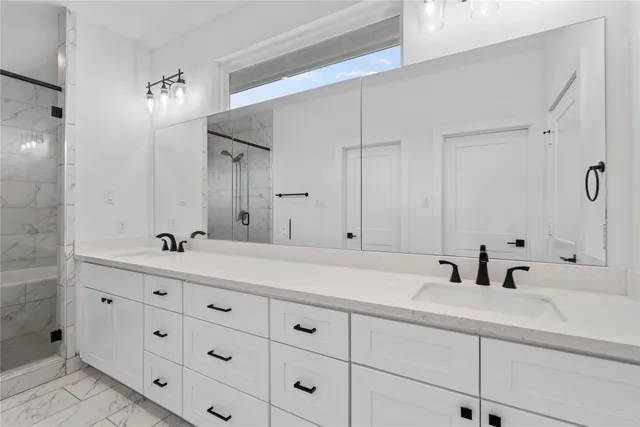 a bathroom with a double vanity sink and mirror
