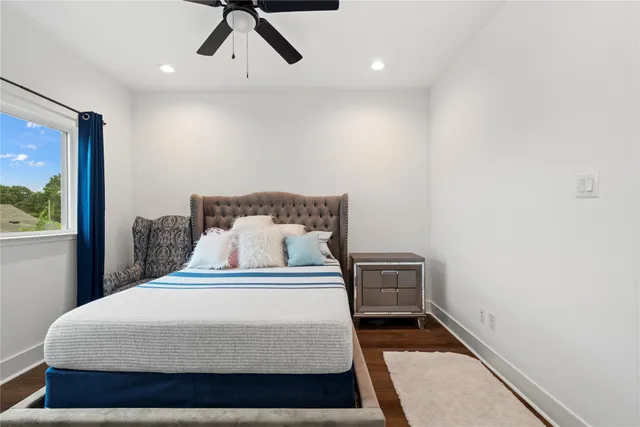 a bedroom with a bed and lamp