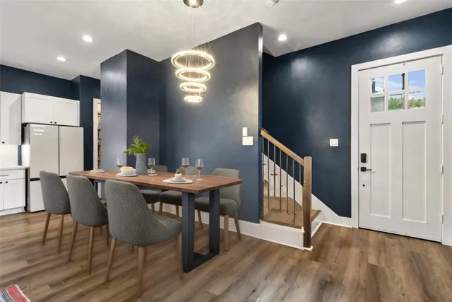 a view of a dining room with furniture and wooden floor