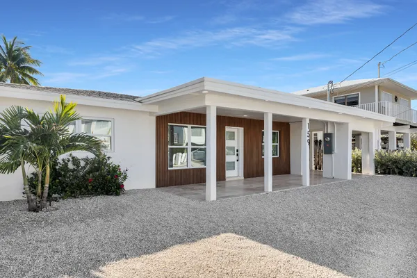 a front view of a house with a porch