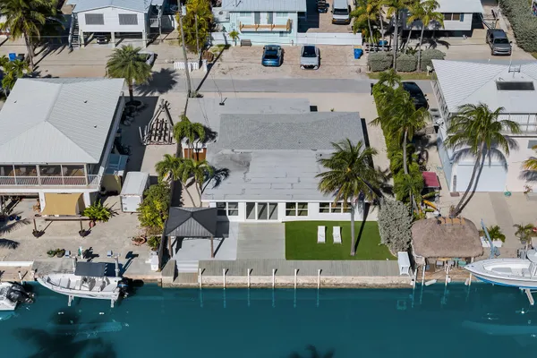 an aerial view of house with yard swimming pool and outdoor seating
