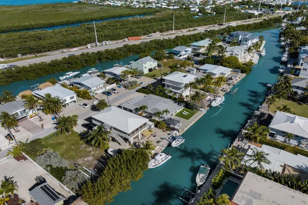 an aerial view of residential houses with outdoor space
