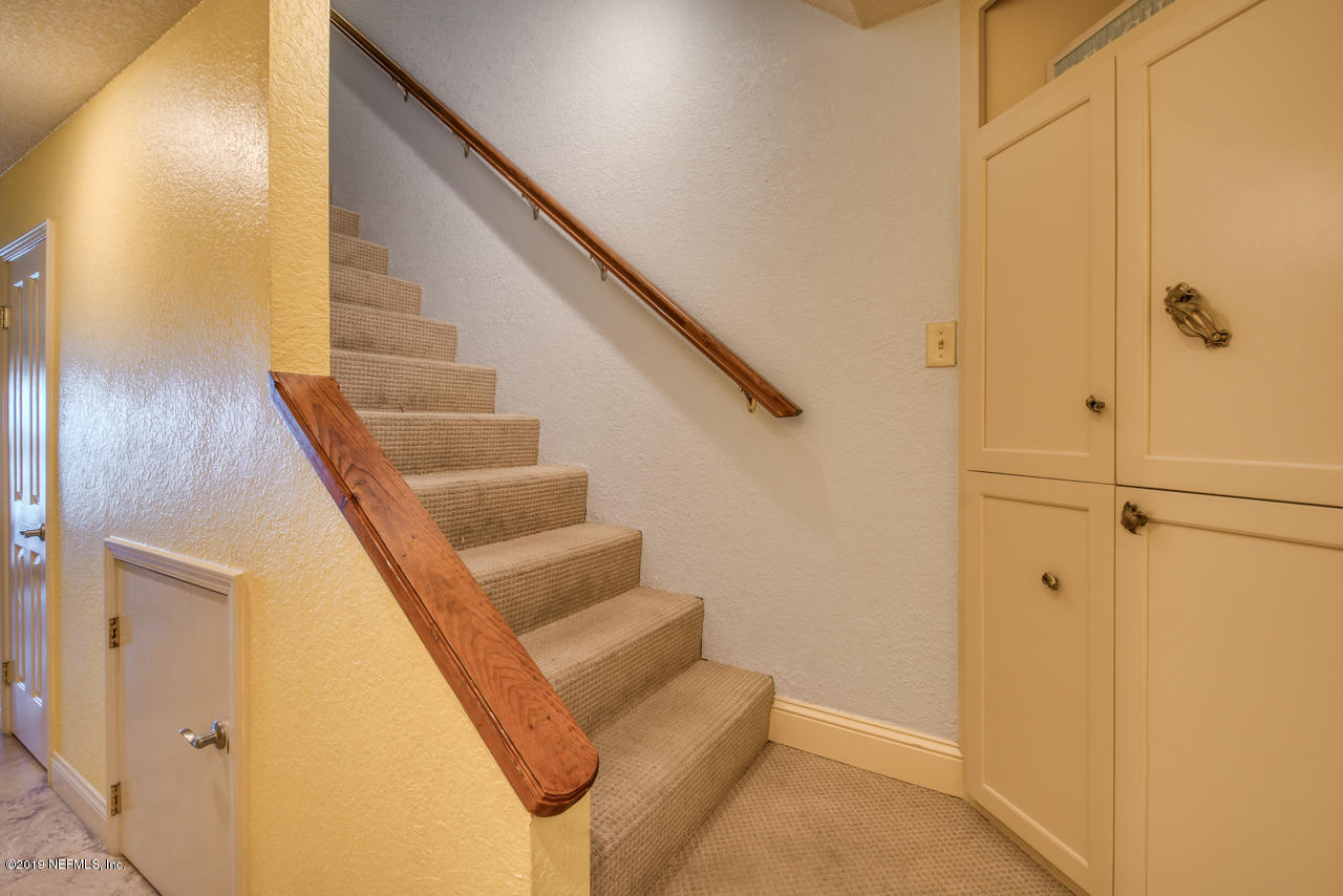 8550 A1A South, Unit 408 St. Augustine, FL 32080 - Photo 13 of 33 a view of entryway and hall with wooden floor