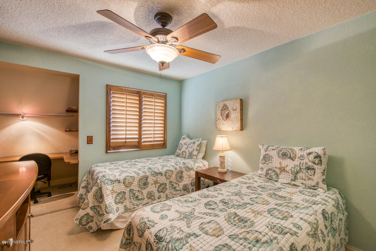 8550 A1A South, Unit 408 St. Augustine, FL 32080 - Photo 20 of 33 a bedroom with two large bed and a window