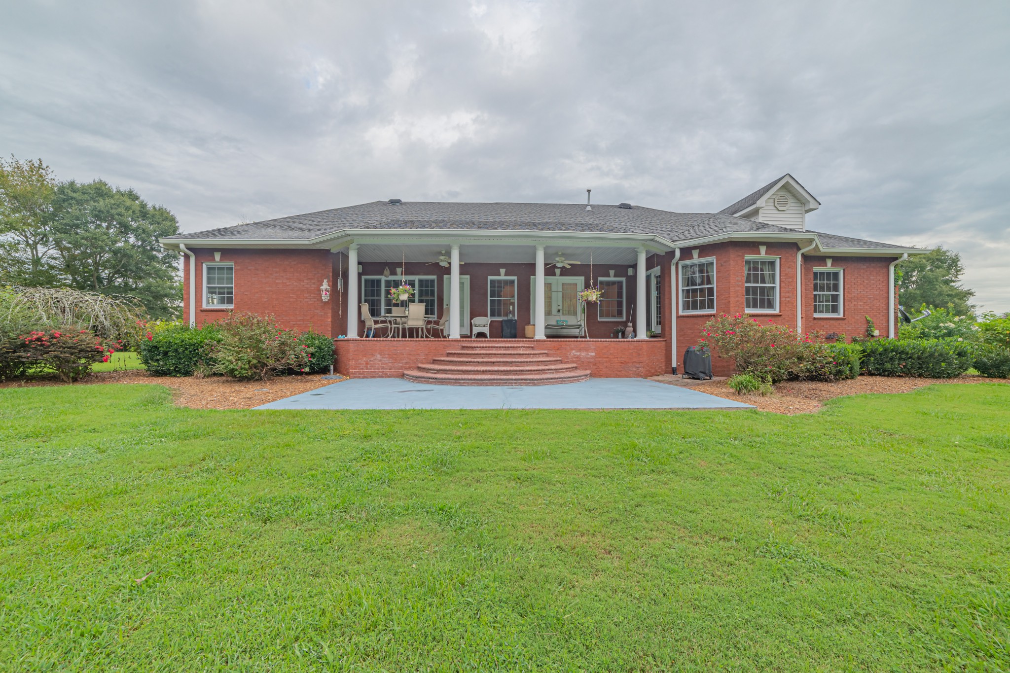 2828 Bains Road Hillsboro, TN 37342 - Photo 11 of 50 a front view of a house with a yard and trees