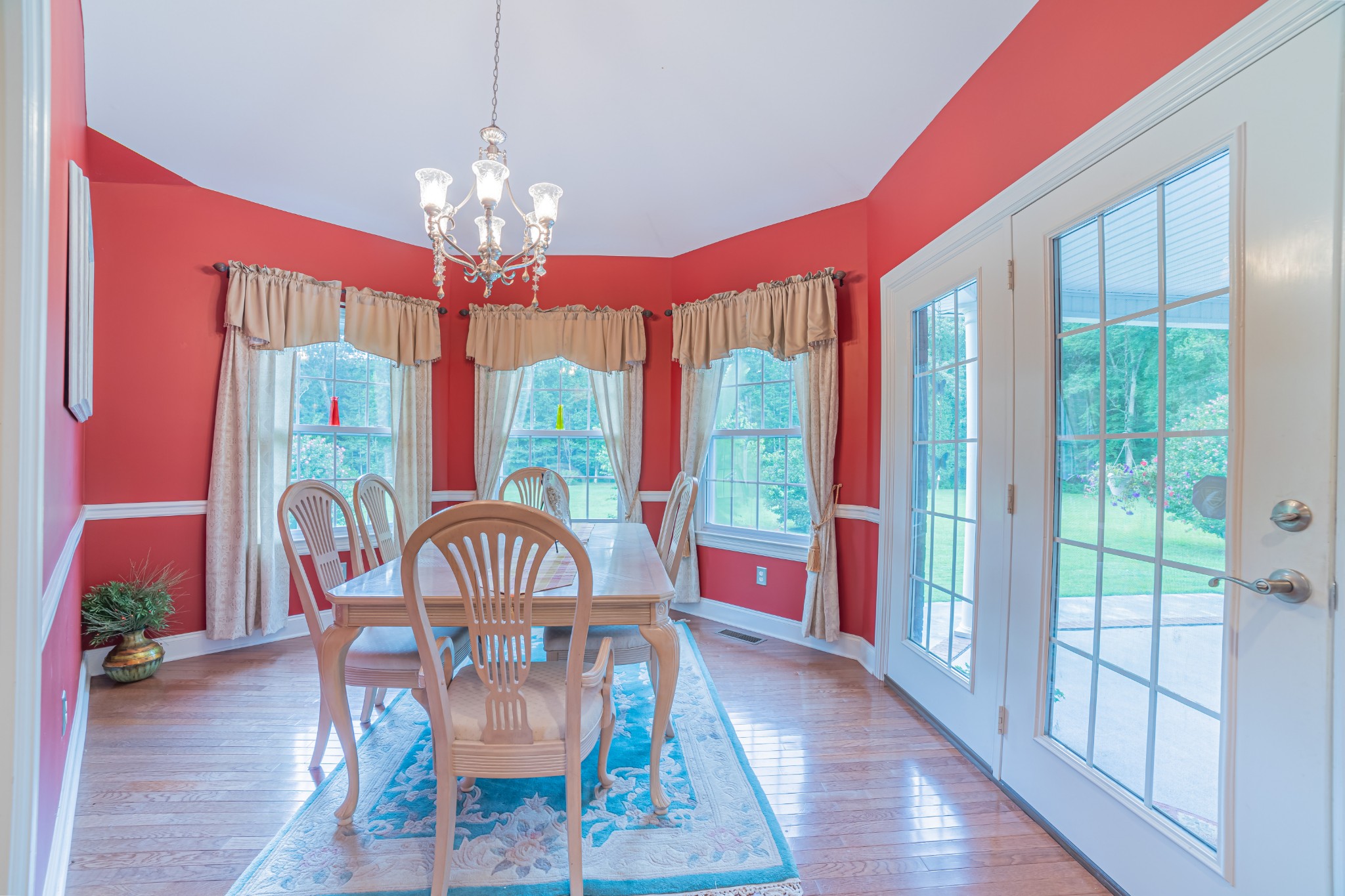 2828 Bains Road Hillsboro, TN 37342 - Photo 21 of 50 a view of a dining room with furniture a chandelier and wooden floor