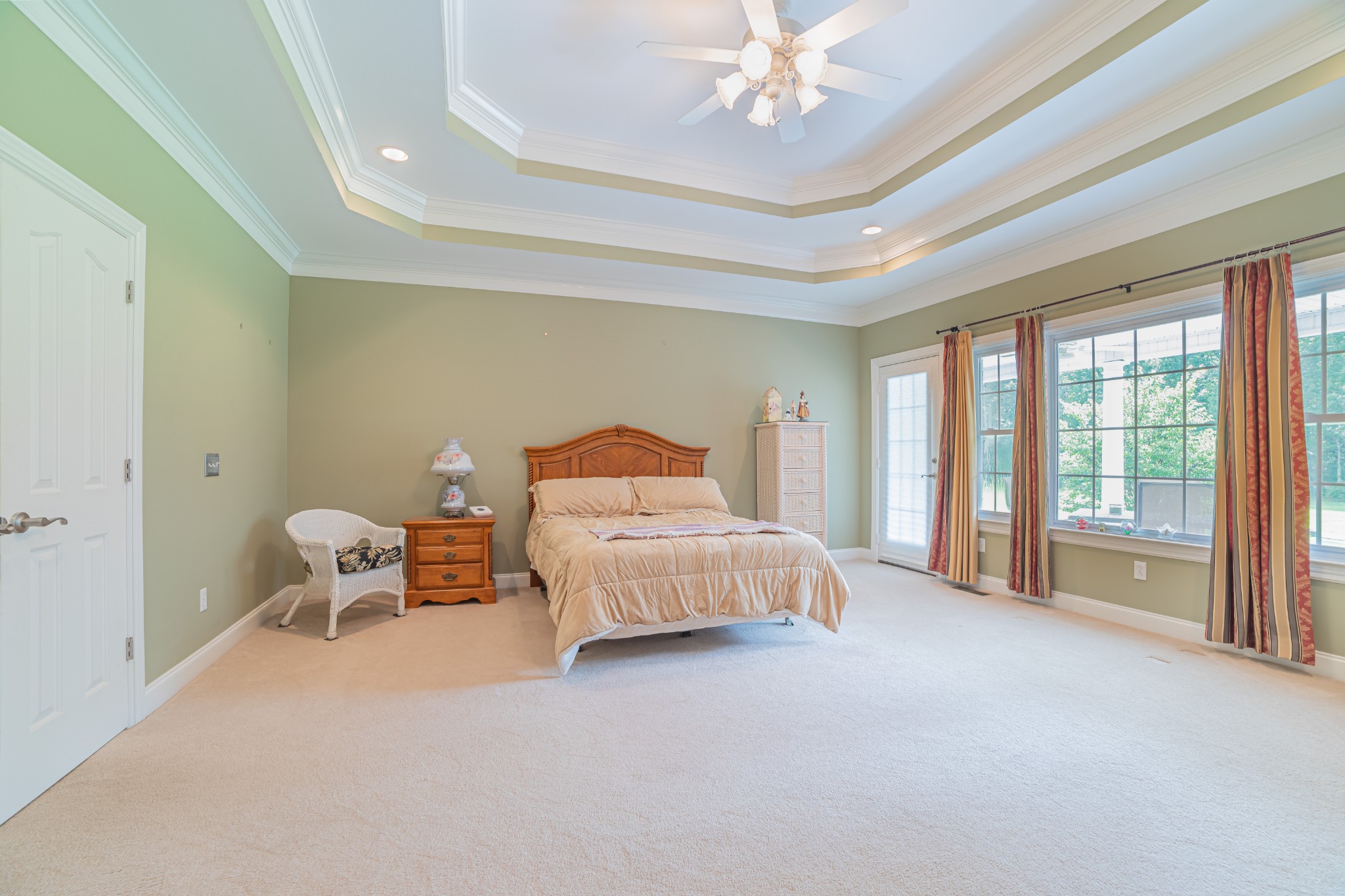 2828 Bains Road Hillsboro, TN 37342 - Photo 37 of 50 a bedroom with a large bed and a chandelier