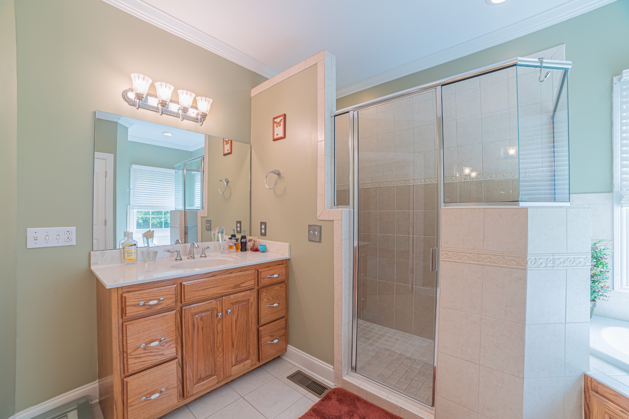 2828 Bains Road Hillsboro, TN 37342 - Photo 40 of 50 a bathroom with a double vanity sink mirror and shower