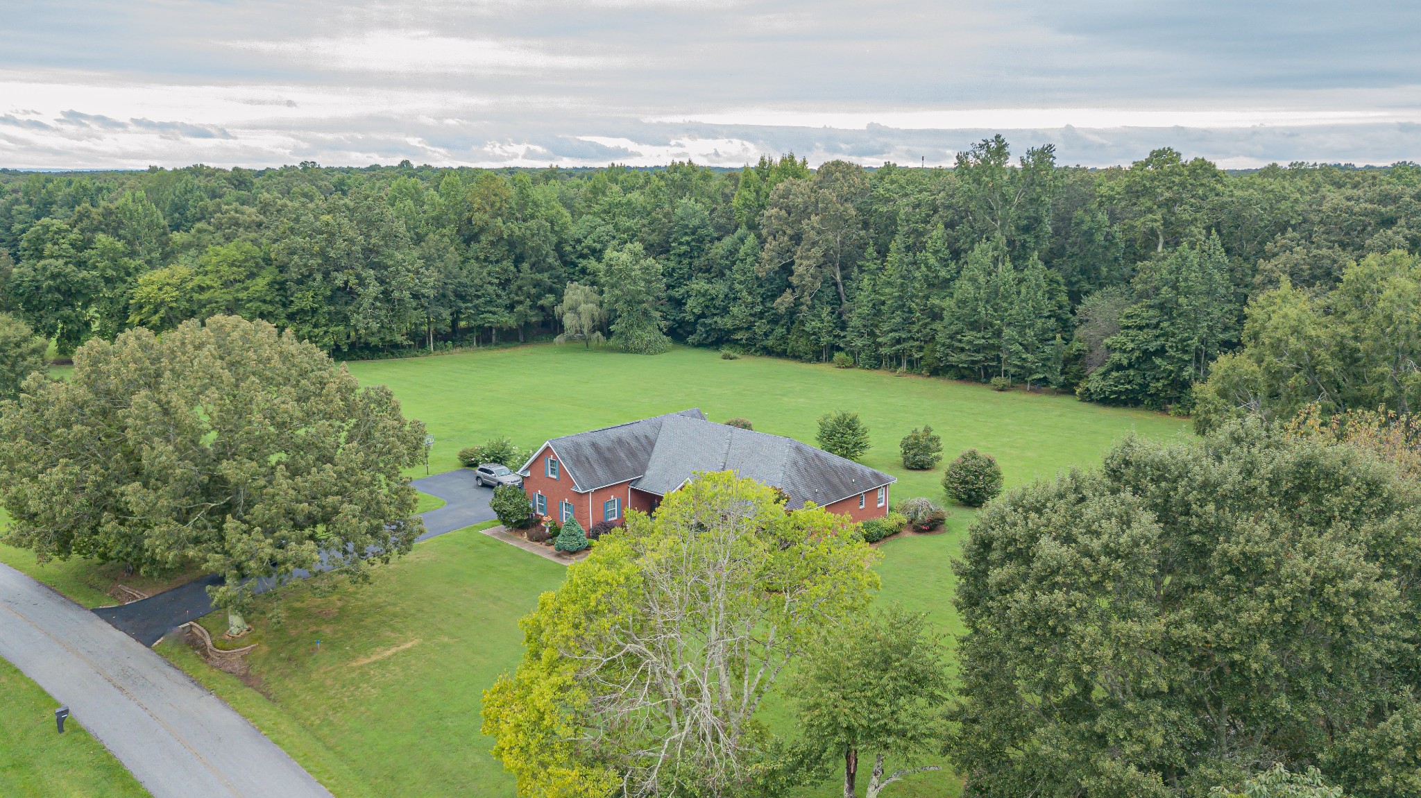 2828 Bains Road Hillsboro, TN 37342 - Photo 5 of 50 a view of a garden with a building in the background