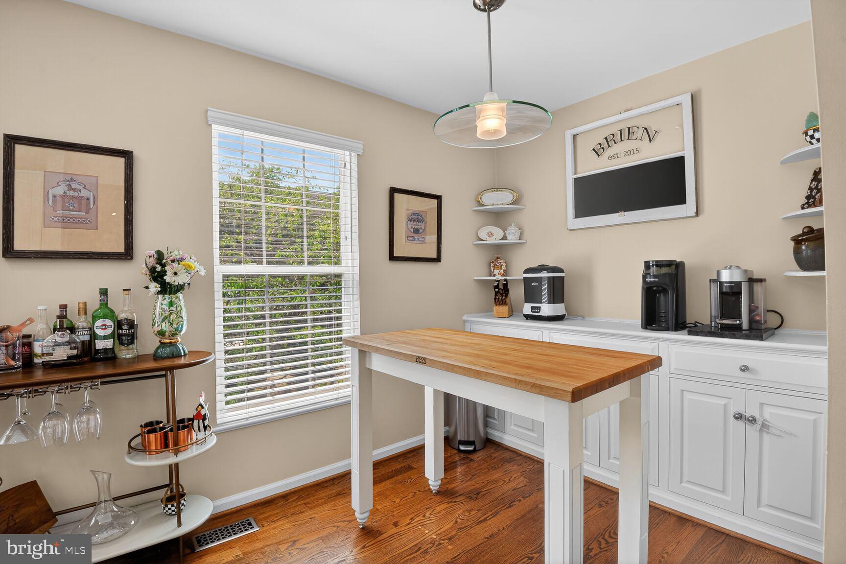 917 Rolfe Place Alexandria, VA 22314 - Photo 12 of 34 a dining room with wooden floor and chandelier