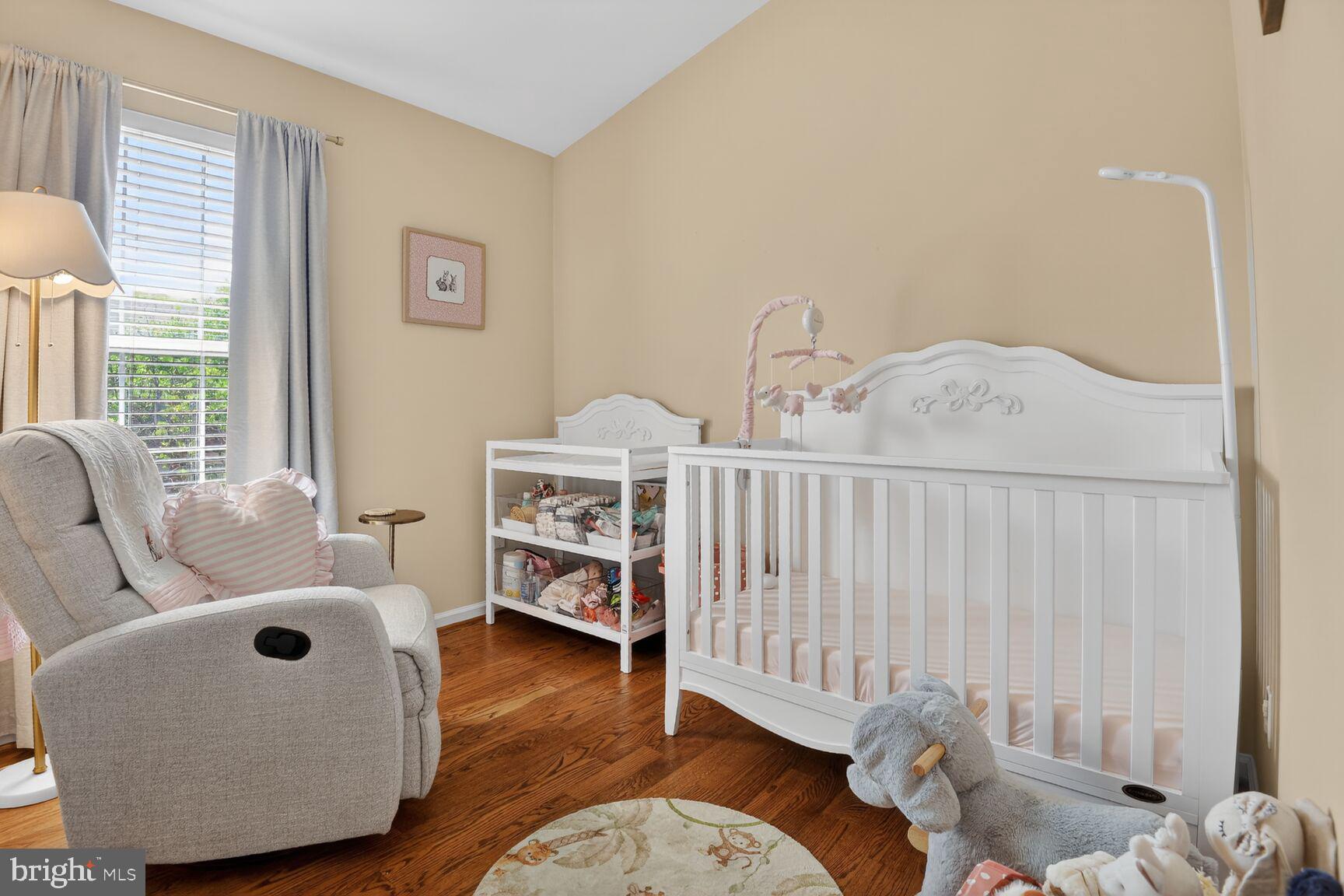 917 Rolfe Place Alexandria, VA 22314 - Photo 21 of 34 a bedroom with furniture and a wooden floor
