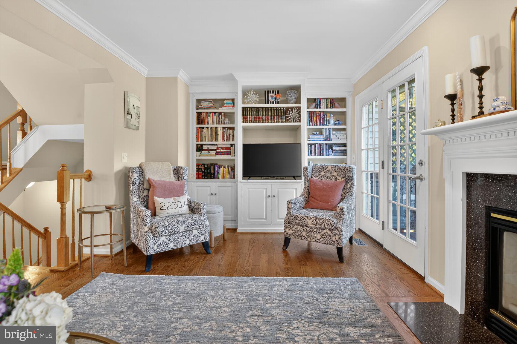 917 Rolfe Place Alexandria, VA 22314 - Photo 3 of 34 a living room with furniture fireplace and a flat screen tv