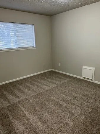 a view of a room that has a window in it