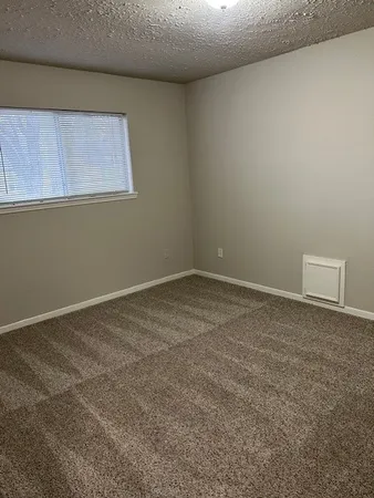 an empty room with a wooden door