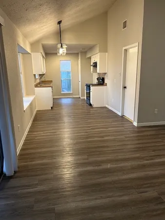 a view of a living room and floor to ceiling window