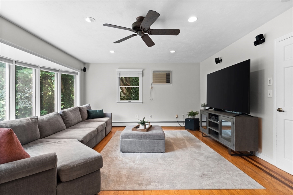 27 Pleasant Street Millis, MA 02054 - Photo 18 of 42 a living room with furniture and a flat screen tv
