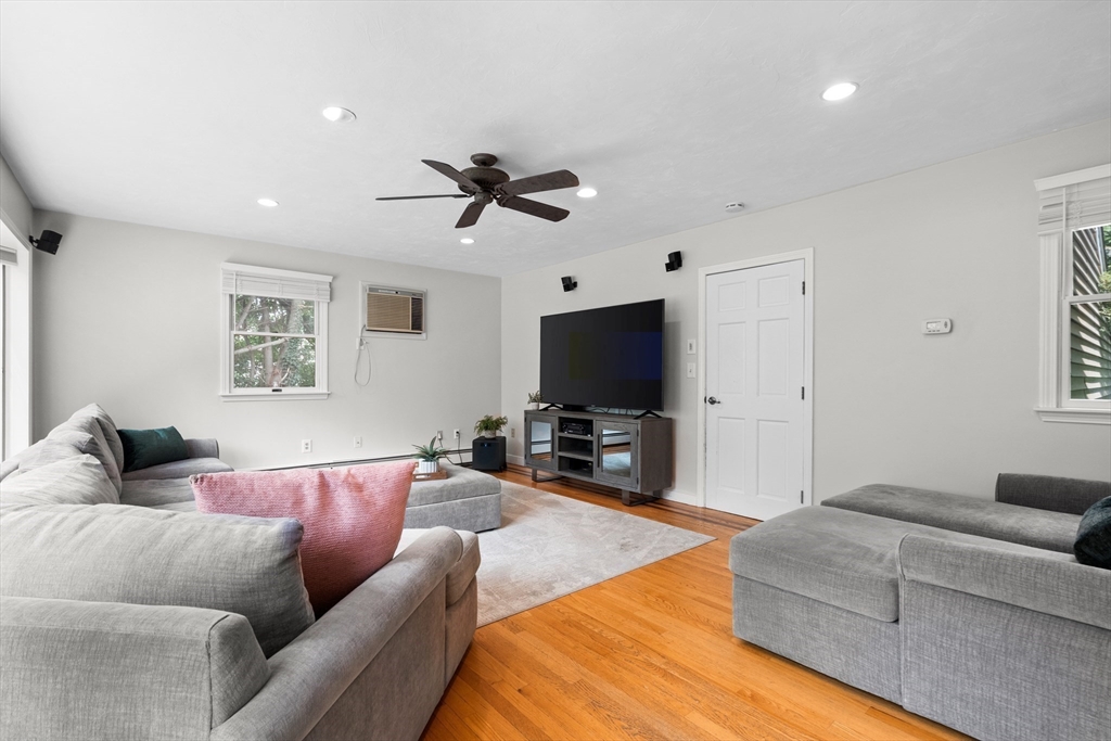 27 Pleasant Street Millis, MA 02054 - Photo 19 of 42 a living room with furniture and a flat screen tv