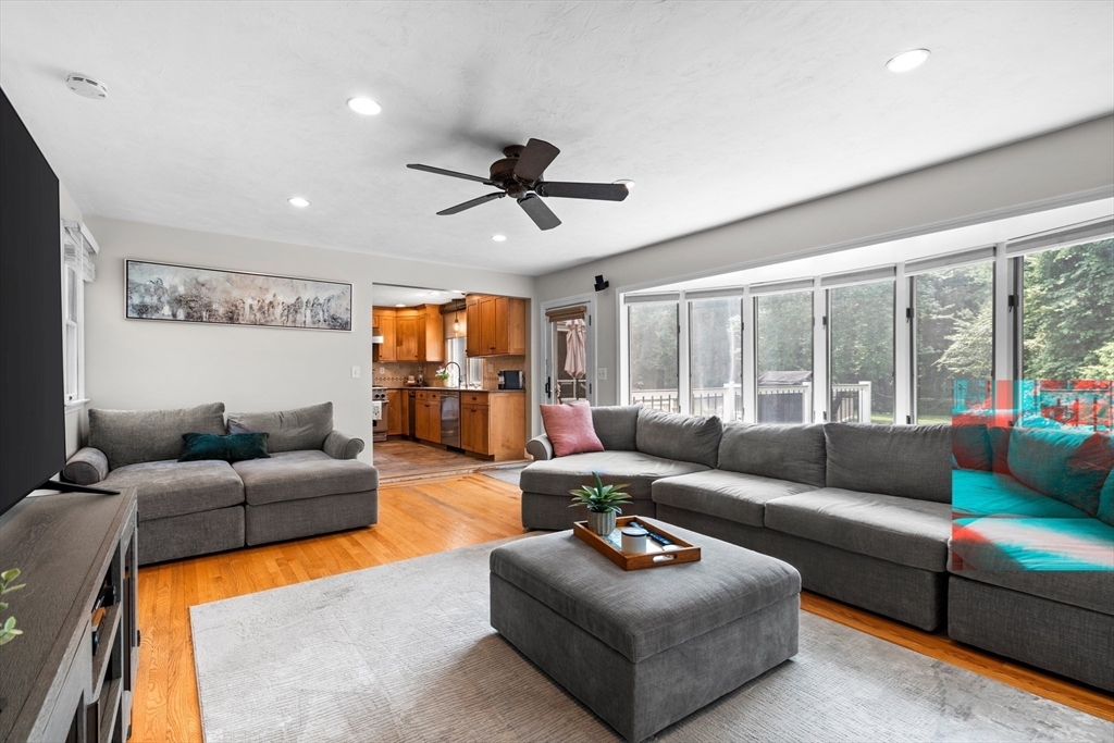 27 Pleasant Street Millis, MA 02054 - Photo 21 of 42 a living room with furniture ceiling fan and a large window