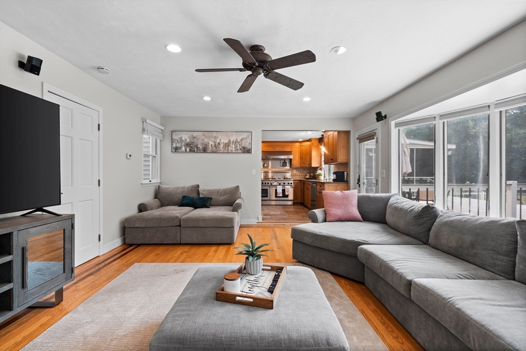 27 Pleasant Street Millis, MA 02054 - Photo 22 of 42 a living room with furniture and a flat screen tv with wooden floor