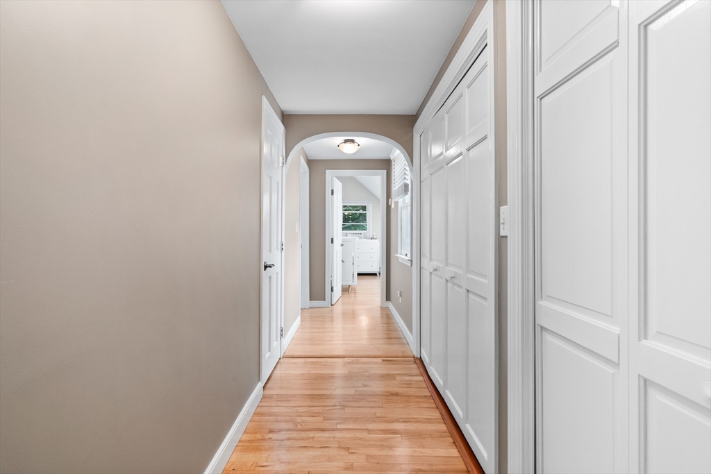 27 Pleasant Street Millis, MA 02054 - Photo 23 of 42 a view of a hallway with wooden floor