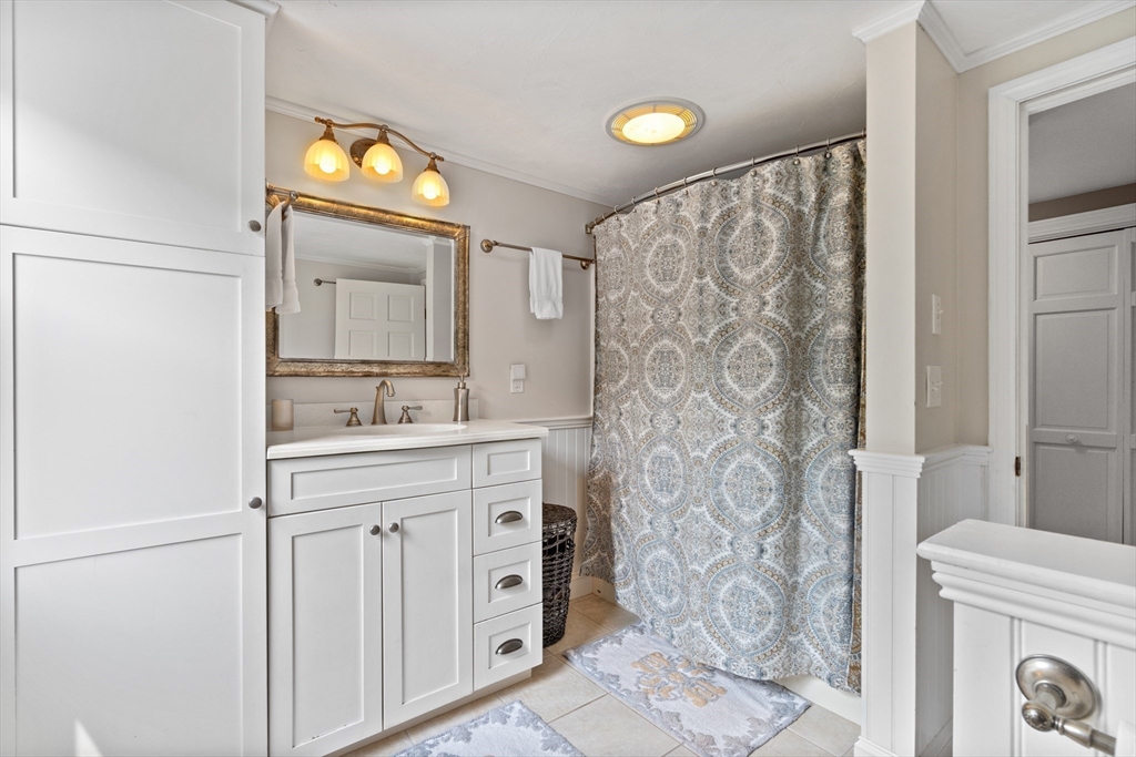 27 Pleasant Street Millis, MA 02054 - Photo 25 of 42 a bathroom with a sink and a mirror