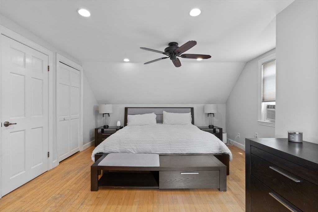 27 Pleasant Street Millis, MA 02054 - Photo 28 of 42 a bedroom with a bed and a chandelier